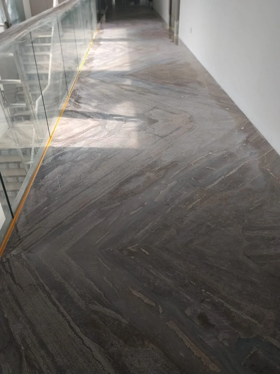 Dark marble chevron hallway